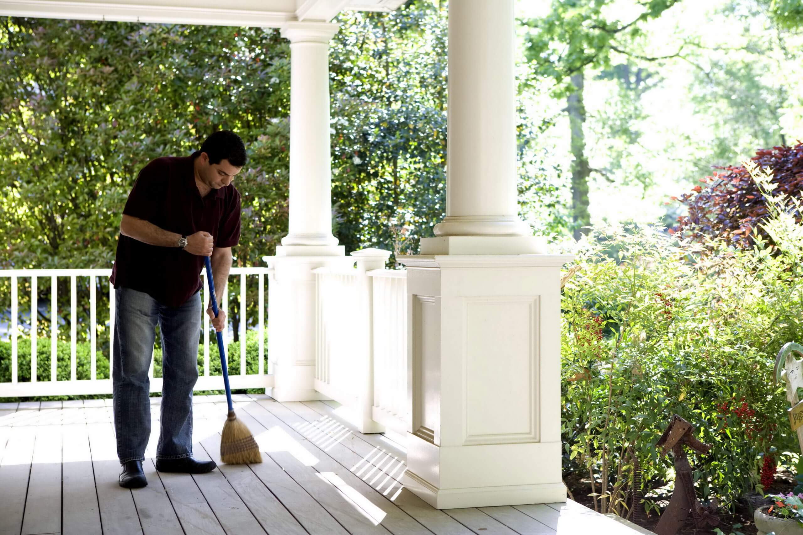 Man Cleaning Porch