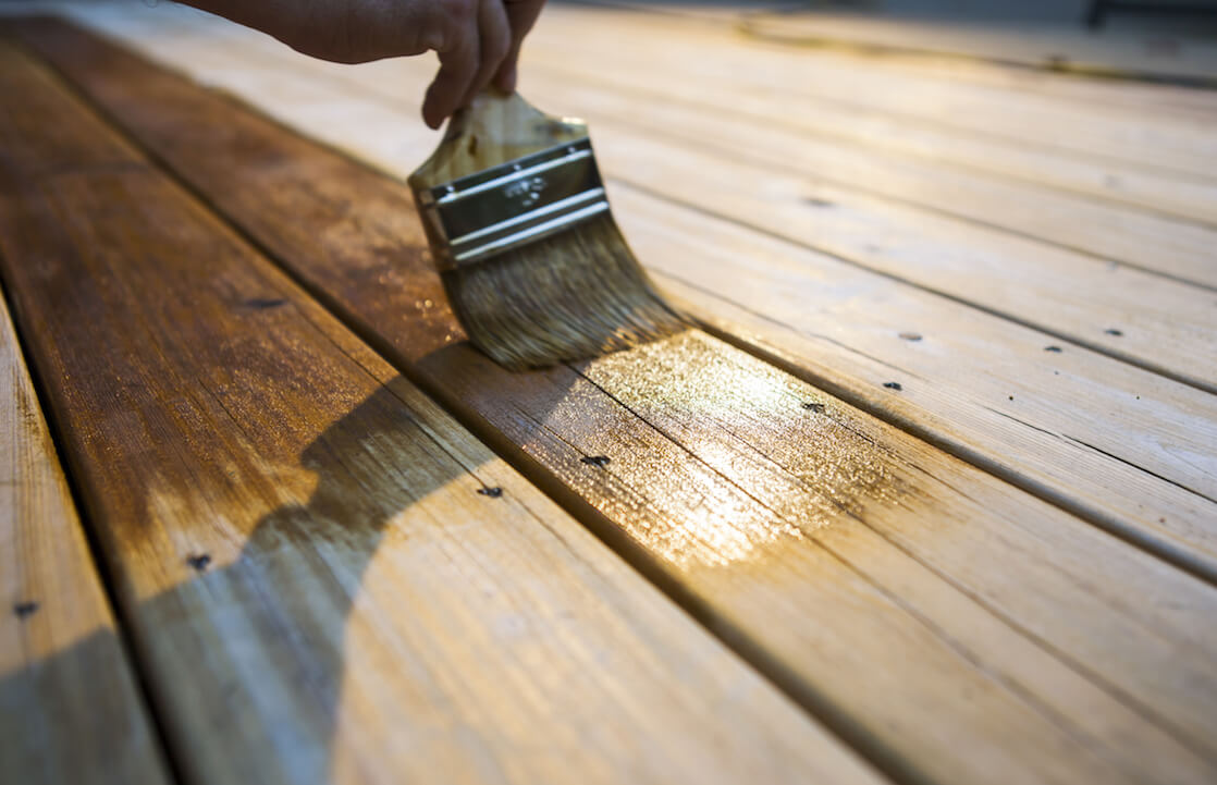 Person Oiling Porch