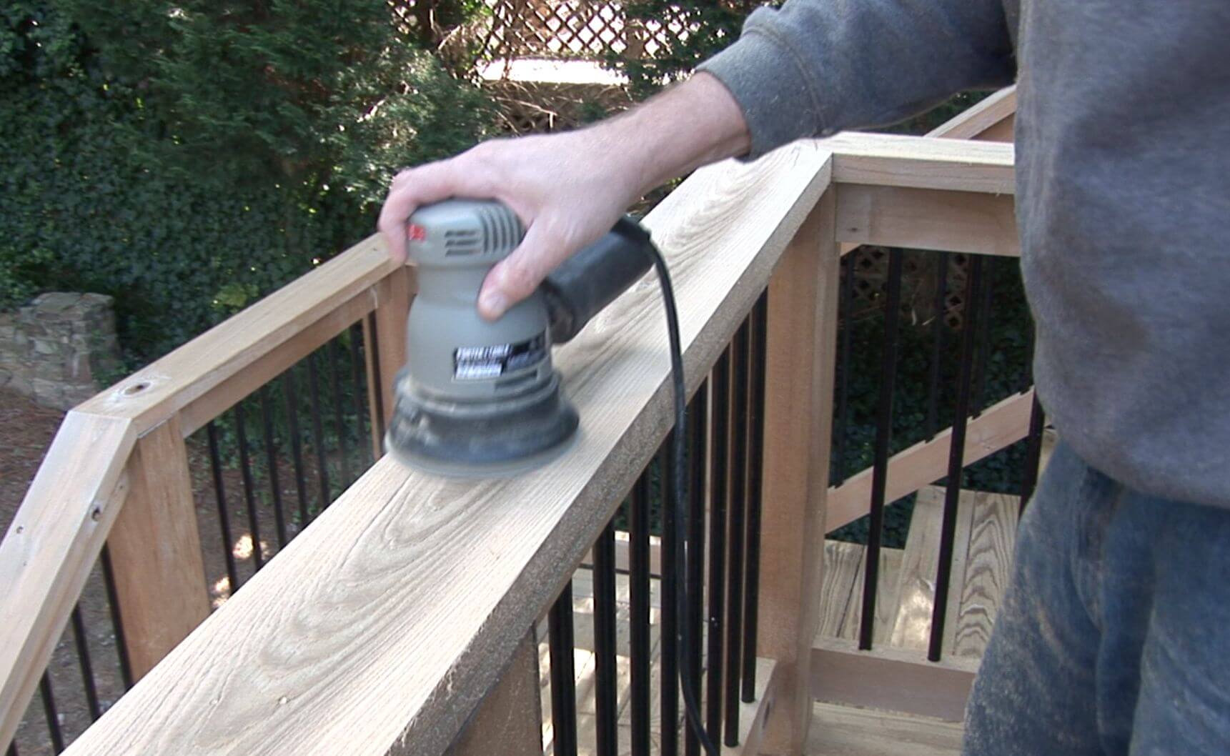 Person using Palm Sander