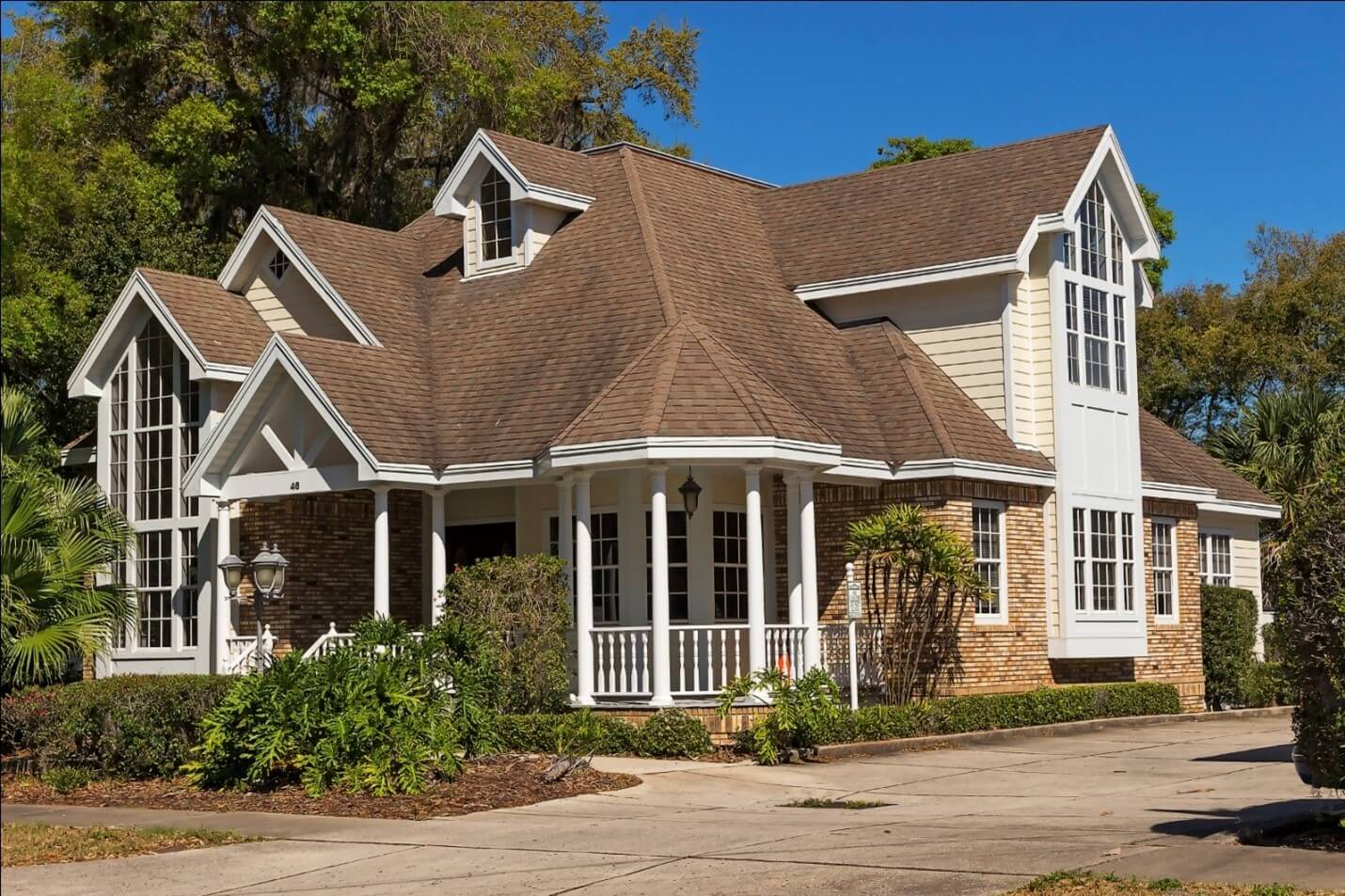 An image of a house with brown colored roof